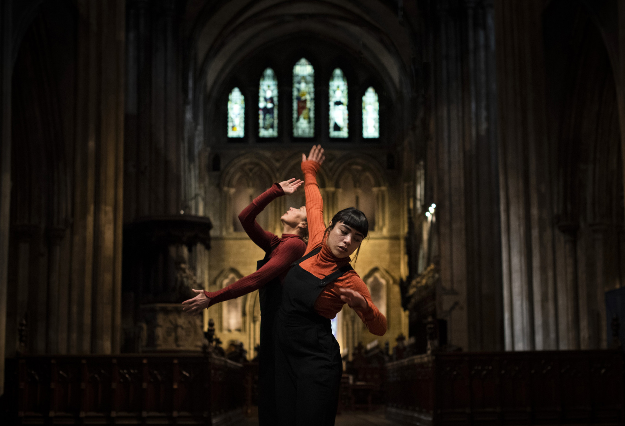 Two female dancers in a church