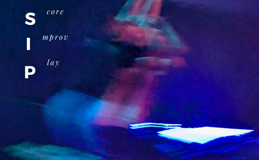 Blurry image in blue tones of a dancer with their arm up in the air, with the words score improv play written on it in white.